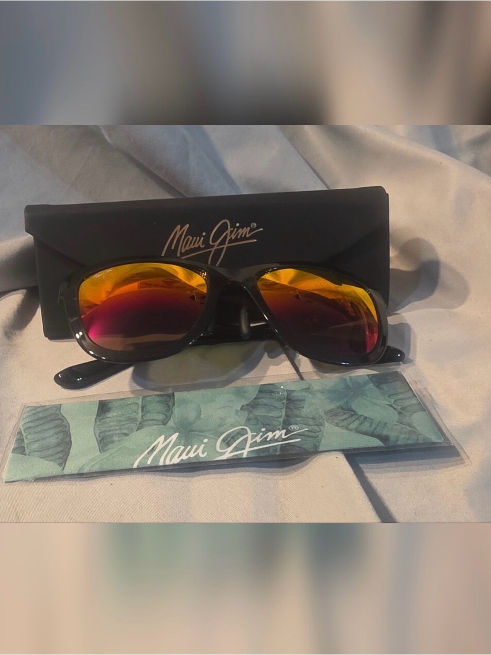 Maui Jim Black Frame Sunglasses with Yellow-Orange to Red Mirrored Lenses